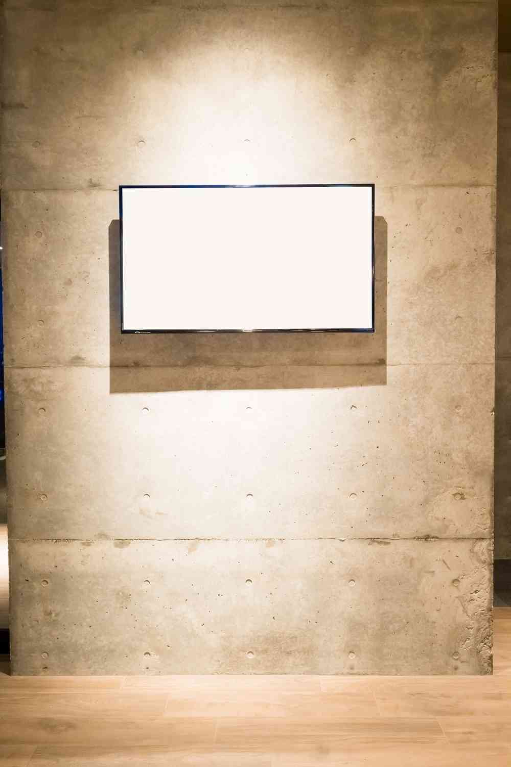 TV wall mounting on the concrete wall.