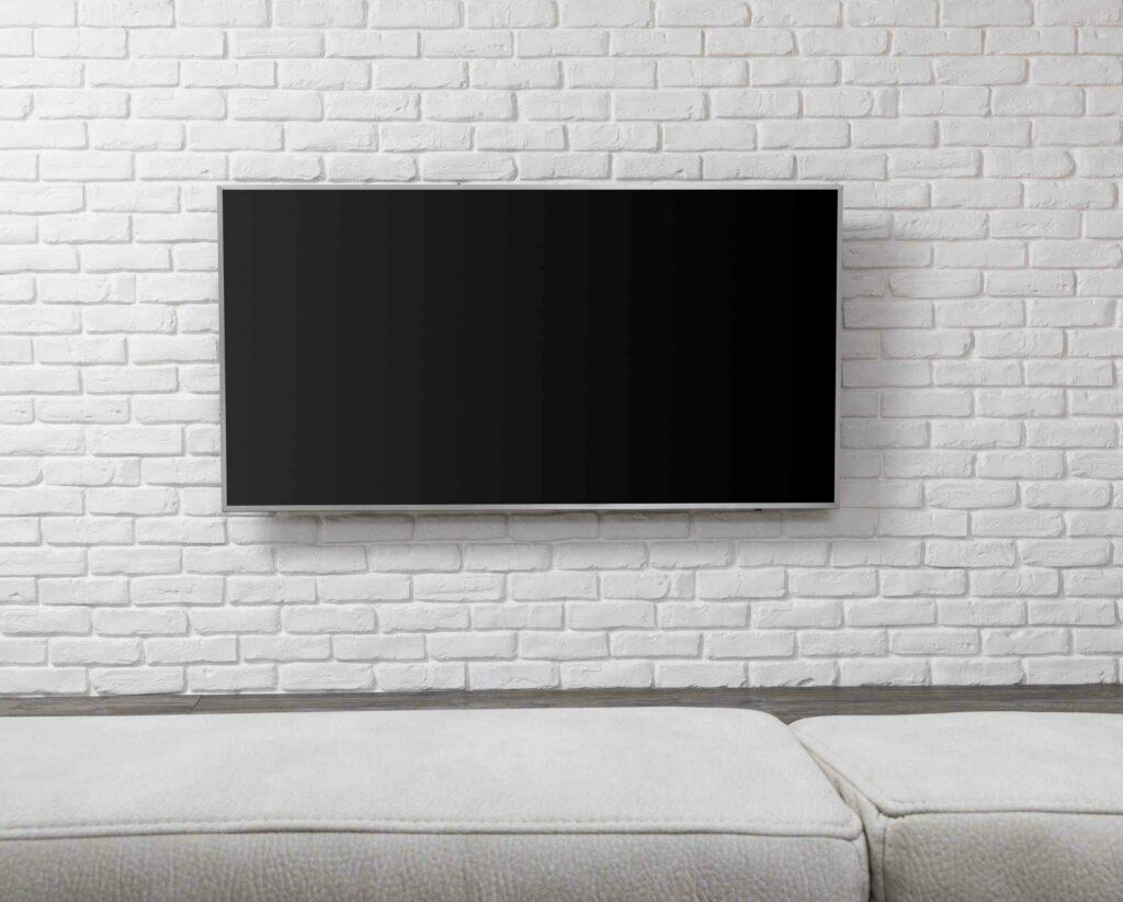 TV wall mounted on the brick.