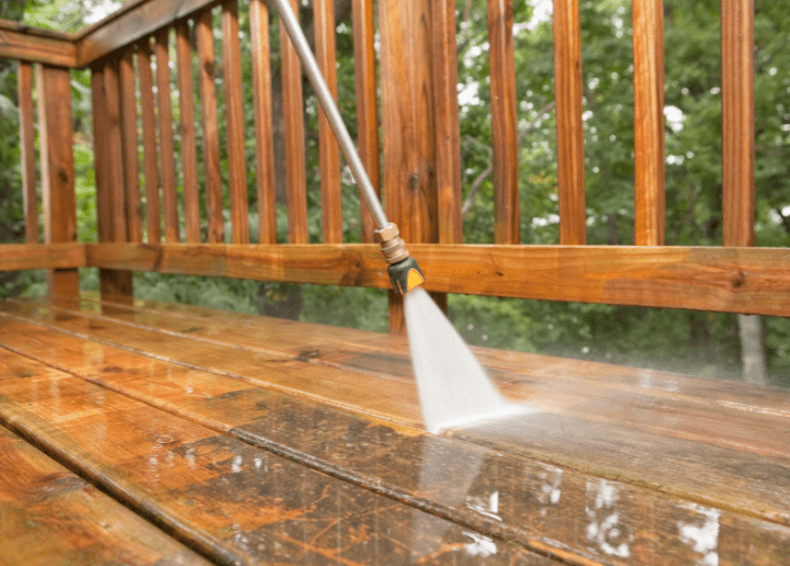 Cleaning a weathered deck with pressure washer
