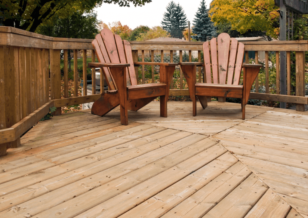 Adirondak chairs on backyard wood deck