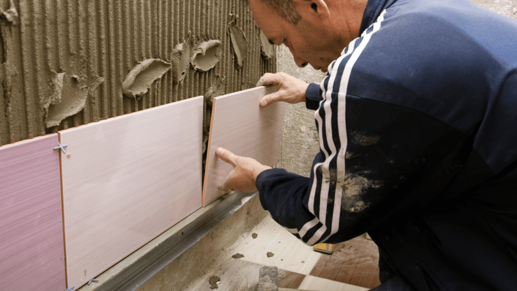 Bathroom Remodeling Contractor putting on Tiles