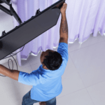 man installing tv