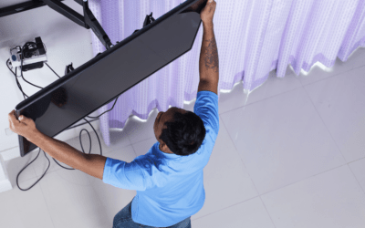 man installing tv